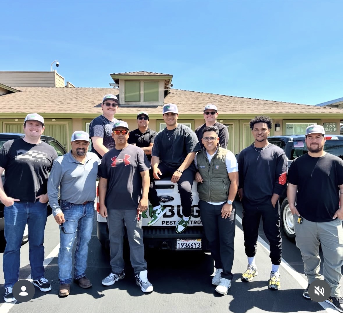The TruBug Pest Control team standing in front of a company truck